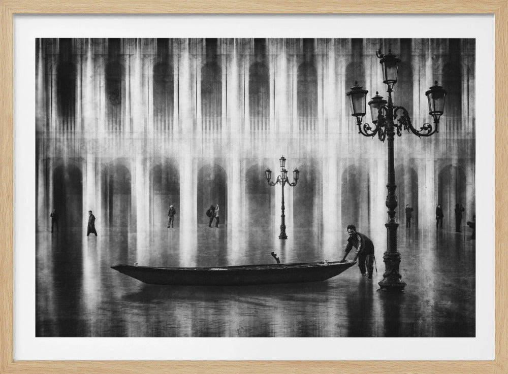 An atmospheric black and white photograph of a flooded St. Mark's Square in Venice. In the foreground, a man pushes a small boat through the shallow water past an ornate lamppost. The background features the grand, illuminated arches of the surrounding buildings, with their reflections shimmering on the water's surface. Poster