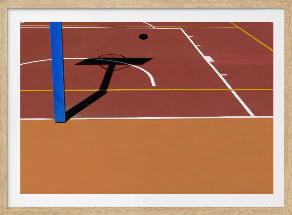 A framed, high-angle minimalist photo of a basketball court, showing a bright blue pole and the stark shadow of the hoop against the red and orange court. Print