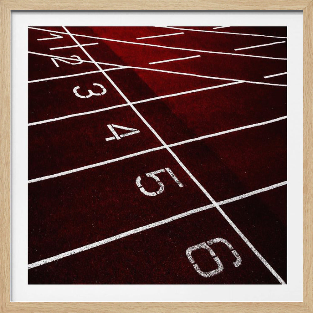 A framed, high-angle photograph of a deep red running track, showing the white lines and numbers for lanes one through six creating a grid-like pattern. Poster