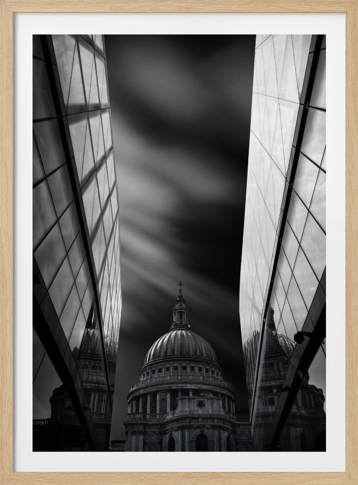 A dramatic black and white, low-angle photograph of St. Paul's Cathedral in London, framed between two modern, reflective glass skyscrapers. A long exposure effect blurs the clouds in the sky, creating streaks of light and shadow behind the cathedral's dome. Poster
