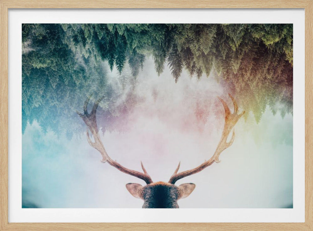 A surreal double-exposure artwork featuring the back of a deer's head with large antlers, blended with an image of a misty pine forest. The forest is reflected above the antlers against a soft, pastel-colored background, all enclosed in a silver frame. Print
