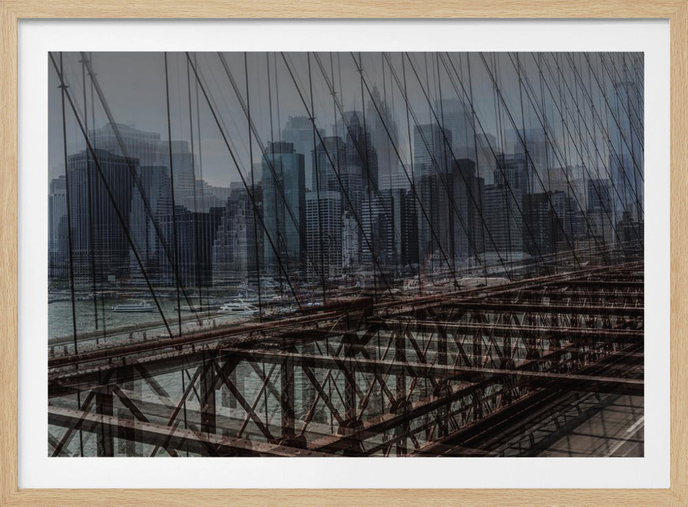 A framed, stylized photograph showing a double exposure of the New York City skyline and the intricate steel structure and cables of the Brooklyn Bridge, creating a dense, layered urban scene with a cool, moody color palette. Decor
