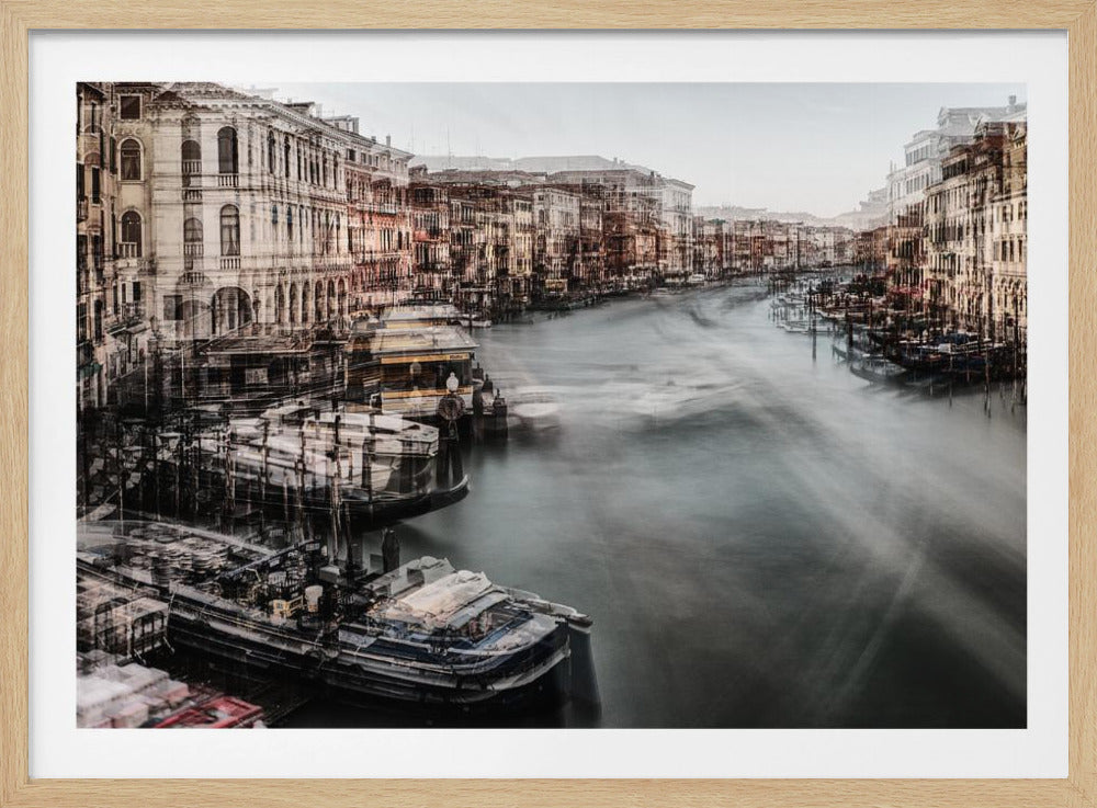An artistic, long-exposure style photograph of the Venice canal in a silver frame. The image has a motion blur and double-exposure effect, making the historic buildings and boats appear layered and ethereal, while the water flows in smooth, ghostly streaks. The color palette is muted with desaturated browns, beiges, and greys. Decor