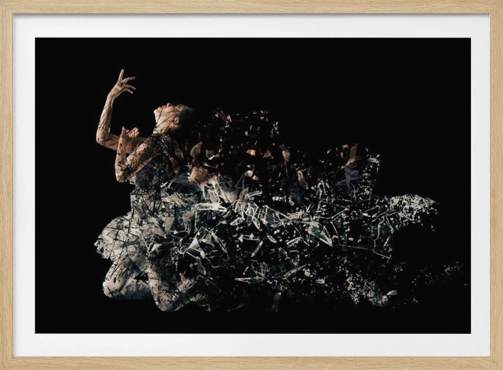 A conceptual piece of artwork depicting a woman in a dynamic pose against a solid black background. Her form appears to be shattering and dissolving into a swirling cloud of broken glass shards, creating a powerful and dramatic effect. The piece is presented within a simple silver frame. Print