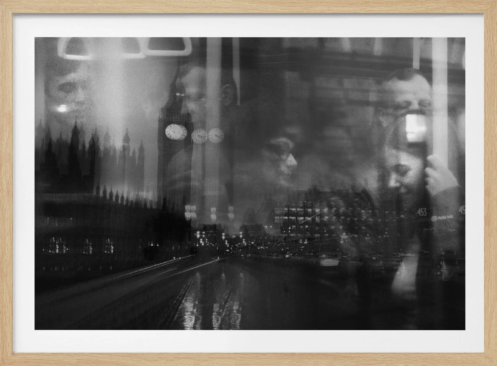 A moody black and white double exposure photograph showing a rainy London street at night with Big Ben, overlaid with the faint reflections of people inside a moving vehicle like a bus. The image has a dreamy, layered effect and is displayed in a silver frame. Print
