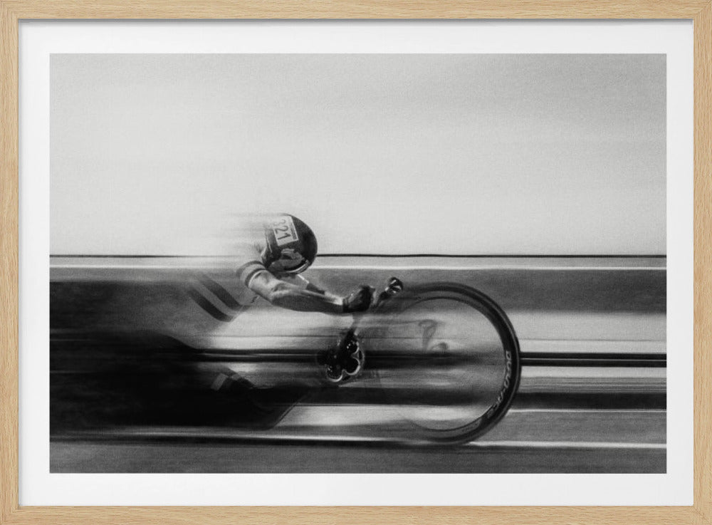A black and white photograph captured with motion blur, showing a cyclist in an aerodynamic position racing at high speed. The background is blurred into horizontal lines, emphasizing the velocity. The image is enclosed in a silver frame. Wall Art