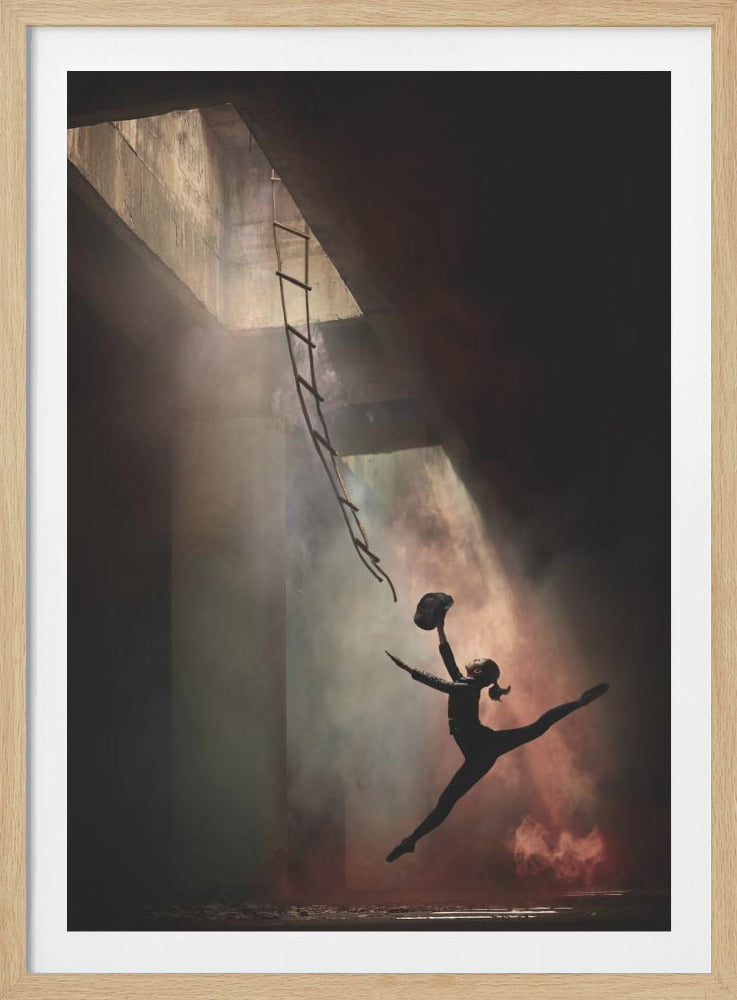 A silhouette of a female dancer in a black leotard is captured mid-air in a dramatic leap, with her legs in a split. She reaches a hat upwards towards a rope ladder descending from a light-filled opening in a dark, concrete ceiling. Beams of light cut through a hazy, smoky atmosphere, creating a moody and hopeful scene of escape or aspiration. Print