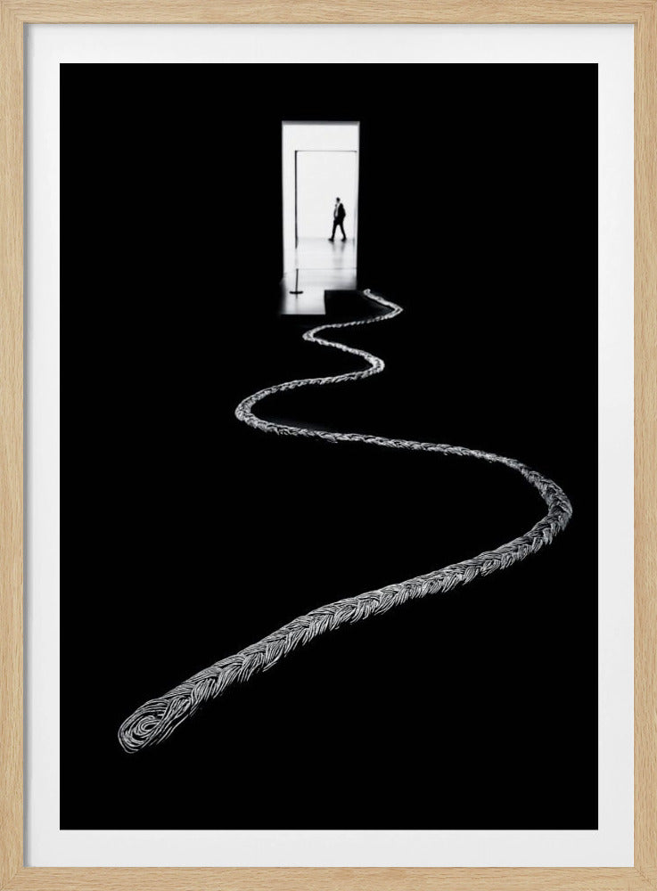 A high-contrast, black and white photograph of a thick, silver, braided rope winding across a black floor, leading towards a brightly lit doorway in the distance where a silhouetted man is walking away. Wall Art