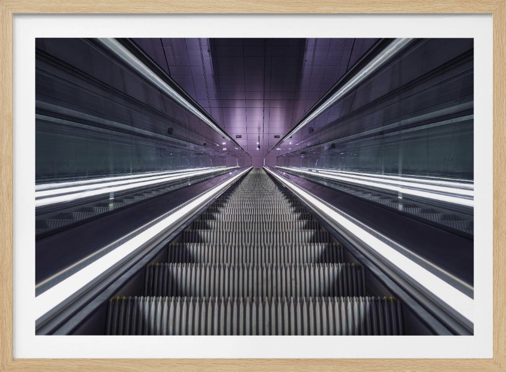 A symmetrical, first-person view looking down a long, empty escalator in a modern subway station, with bright white lights lining the handrails and a purple glow on the ceiling, creating a futuristic and infinite perspective. Wall Art