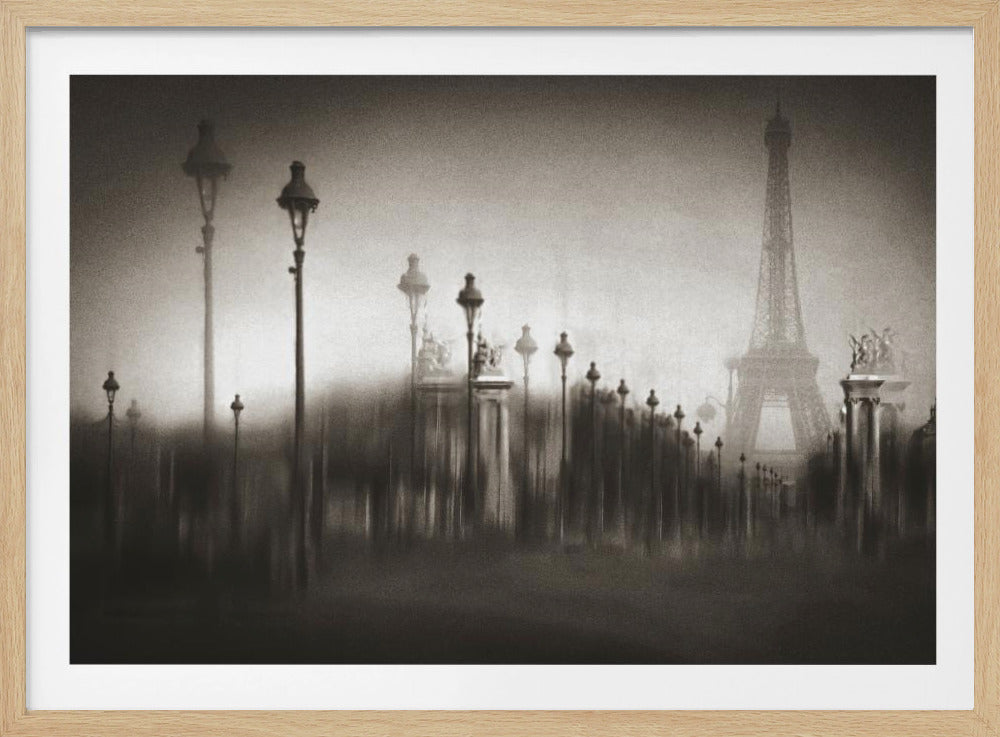 A moody, artistic black and white photograph of Paris in the fog. The image is blurred, creating a dreamy, impressionistic effect, with a row of ornate street lamps leading the eye towards the faint silhouette of the Eiffel Tower in the distance. Artwork