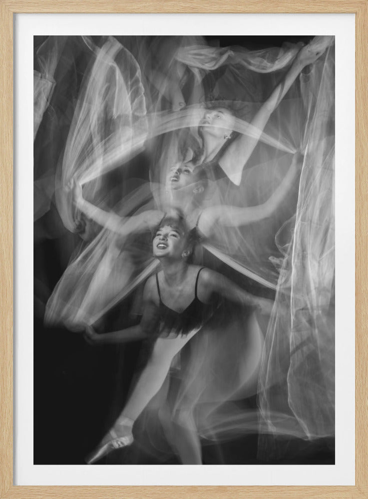A black and white long-exposure photograph capturing the fluid movements of a female dancer. Multiple semi-transparent images of her overlap, showing her in various graceful poses with flowing white fabric against a dark background, creating a dreamlike and dynamic effect. Poster