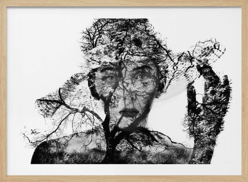A surreal black and white double exposure artwork in a silver frame. The image combines a close-up portrait of a person's face with the intricate silhouette of bare, branching trees against a white background, creating a complex and thought-provoking visual. Poster