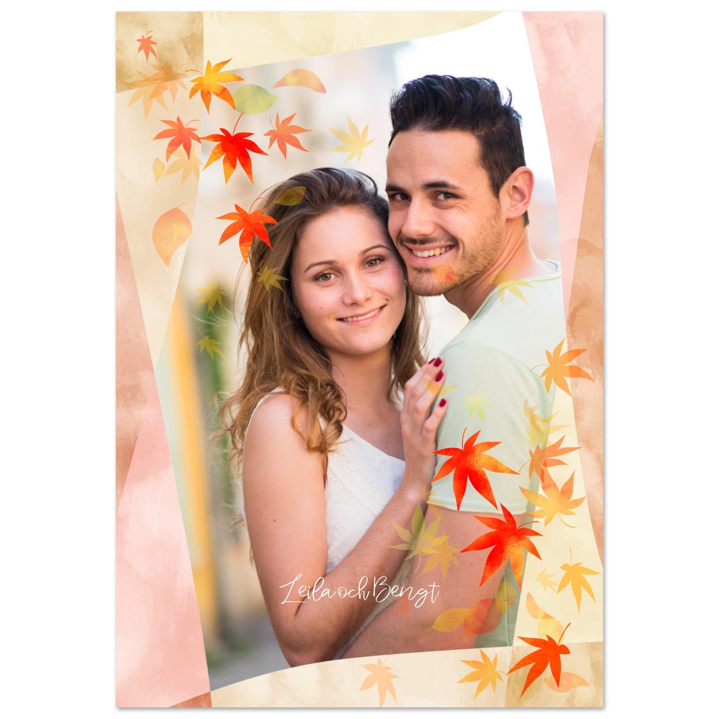 A personalized photo poster featuring a smiling couple embracing. The image is framed with a modern, geometric watercolor border in pink and beige, and is adorned with falling autumn leaves in shades of orange and yellow. The names 'Leila och Bengt' are written in a script font at the bottom. Artwork