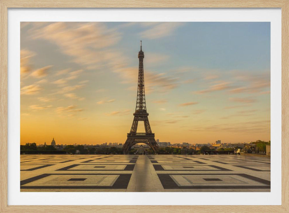 A poster or art print depicting a sunrise scene at Trocadero, likely featuring warm colors and possibly the Eiffel Tower. Poster