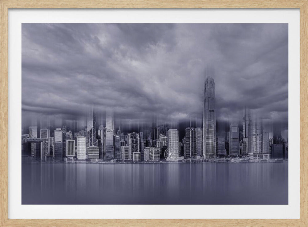 A stylized, monochromatic cityscape photograph of a modern skyline reflected in water under a dramatic, cloudy sky. The image has a vertical blur effect, creating a surreal and futuristic feel, and is displayed within a silver frame. Wall Art