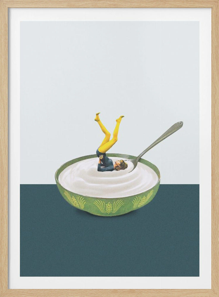 A surreal collage featuring a tiny woman with bright yellow legs doing a yoga pose in a green bowl of white yogurt. A large spoon rests in the bowl next to her, all set against a two-tone background of off-white and dark teal, enclosed in a black frame. Decor