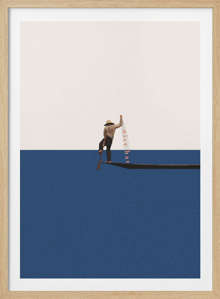 A minimalist collage of a person wearing a straw hat standing at the end of a long, narrow boat or plank, set against a background split horizontally into solid white and solid blue. The person holds a paddle and a strip of paper with text that reads 'nice hat'. Artwork