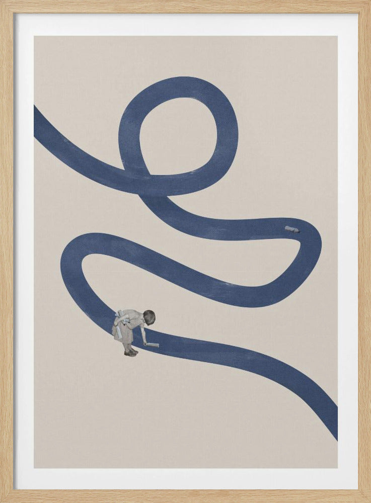 A minimalist collage artwork featuring a thick, winding blue path on a textured beige background. In the lower half, a small child is shown leaning over and appearing to paint the blue path with a roller, creating a surreal and imaginative scene. The artwork is presented in a thin black frame. Decor