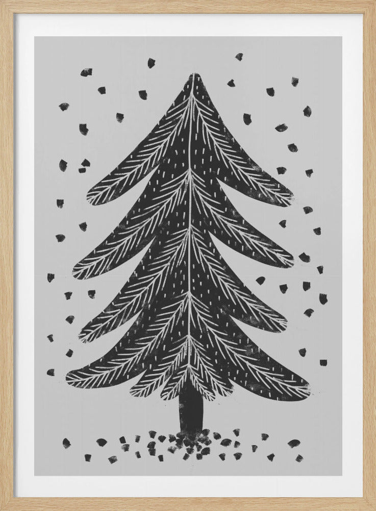 A black and white block print illustration of a stylized Christmas tree against a light gray background. Black specks representing falling snow surround the tree. The artwork has a rustic, folk art feel and is presented in a black frame. Print