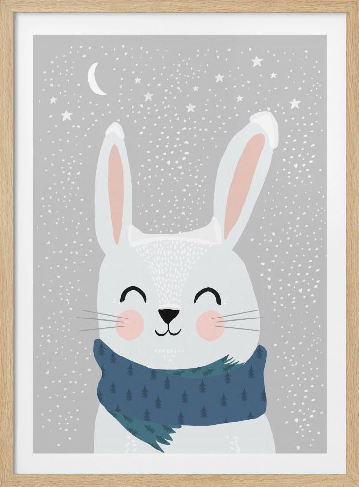 A cute, cartoon illustration of a happy white rabbit with rosy cheeks wearing a blue scarf with a tree pattern. It is snowing against a grey sky with a crescent moon and stars. Artwork