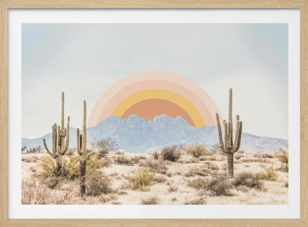 A stylized desert landscape featuring two large saguaro cacti in the foreground. In the background, a graphic semi-circle rainbow with bands of peach, orange, and yellow rises behind a range of hazy blue mountains under a pale sky. Print