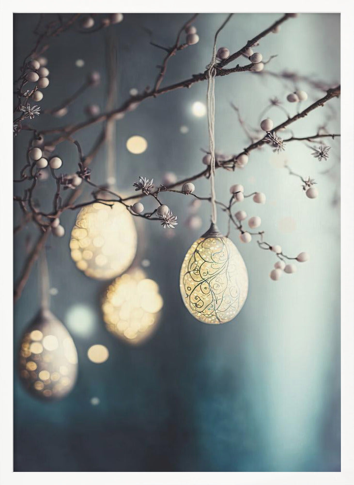 A close-up photograph of luminous egg-shaped ornaments hanging from delicate, bare branches adorned with small white berries. One ornament in the foreground has intricate filigree patterns. The background is a soft, moody blue with glowing bokeh lights, creating a magical and serene atmosphere. Poster