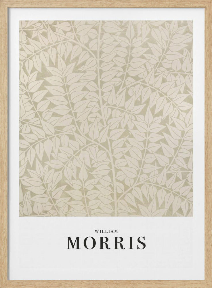 A framed art print by William Morris featuring a dense, repeating pattern of stylized leaves and branches in cream and light sage green. A white border at the bottom displays 'WILLIAM MORRIS' in a black serif font. Artwork