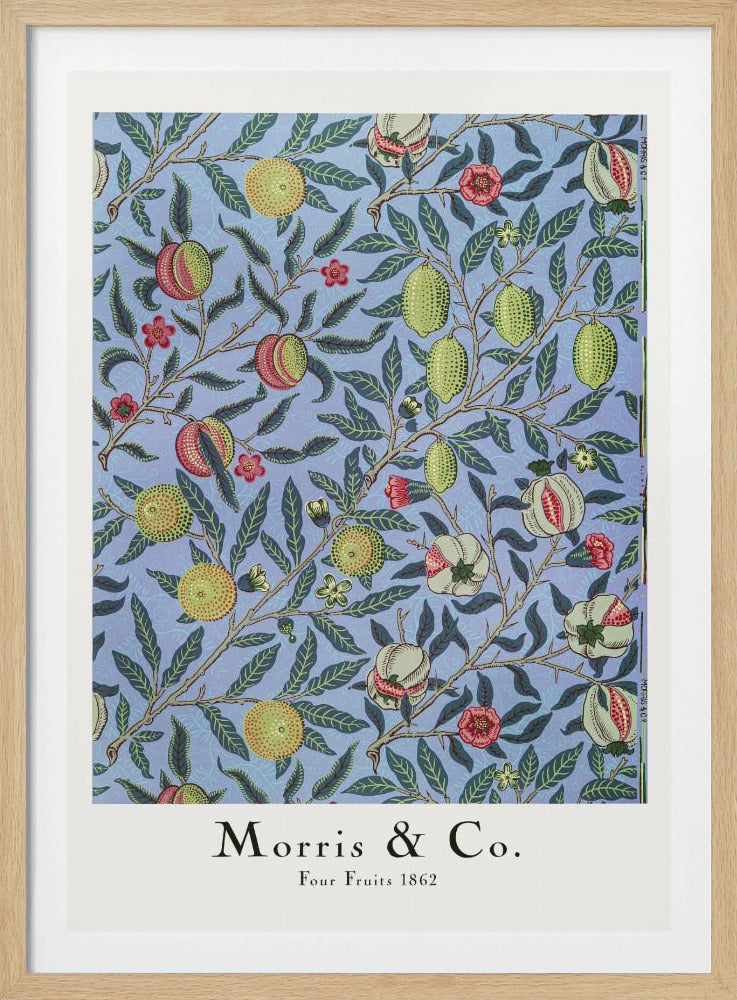 A framed art print of the 'Four Fruits 1862' pattern by Morris & Co. The intricate botanical design features various fruits like lemons, pomegranates, and oranges, along with red and yellow flowers, all intertwined on branches with dark green leaves against a light blue background. Poster