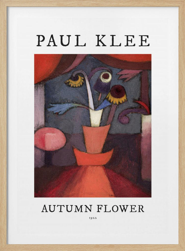 A poster of Paul Klee's 1922 painting 'Autumn Flower'. The abstract artwork features a stylized vase with surreal flowers in shades of red, orange, blue, and purple. The poster has a white border with 'PAUL KLEE' at the top and 'AUTUMN FLOWER 1922' at the bottom, all within a thin black frame. Poster