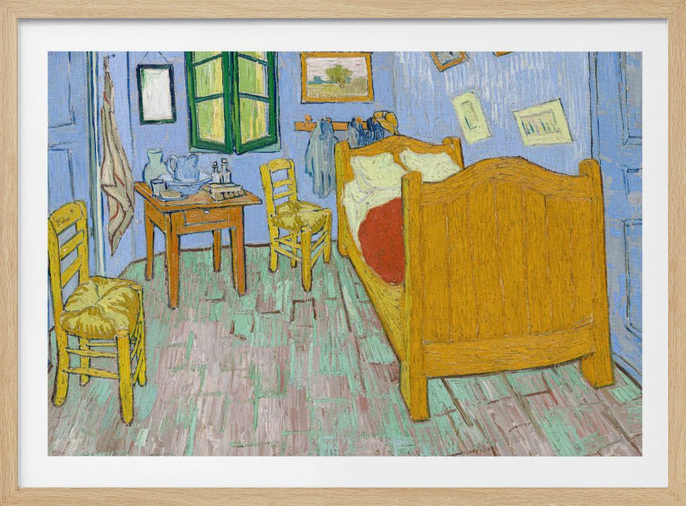 Vincent van Gogh's famous painting, 'The Bedroom,' depicting his room in Arles. The artwork, characterized by bold colors and expressive brushstrokes, features a yellow wooden bed, chairs, a small table against light blue walls, and a green-shuttered window. The painting is displayed in a simple silver frame. Decor