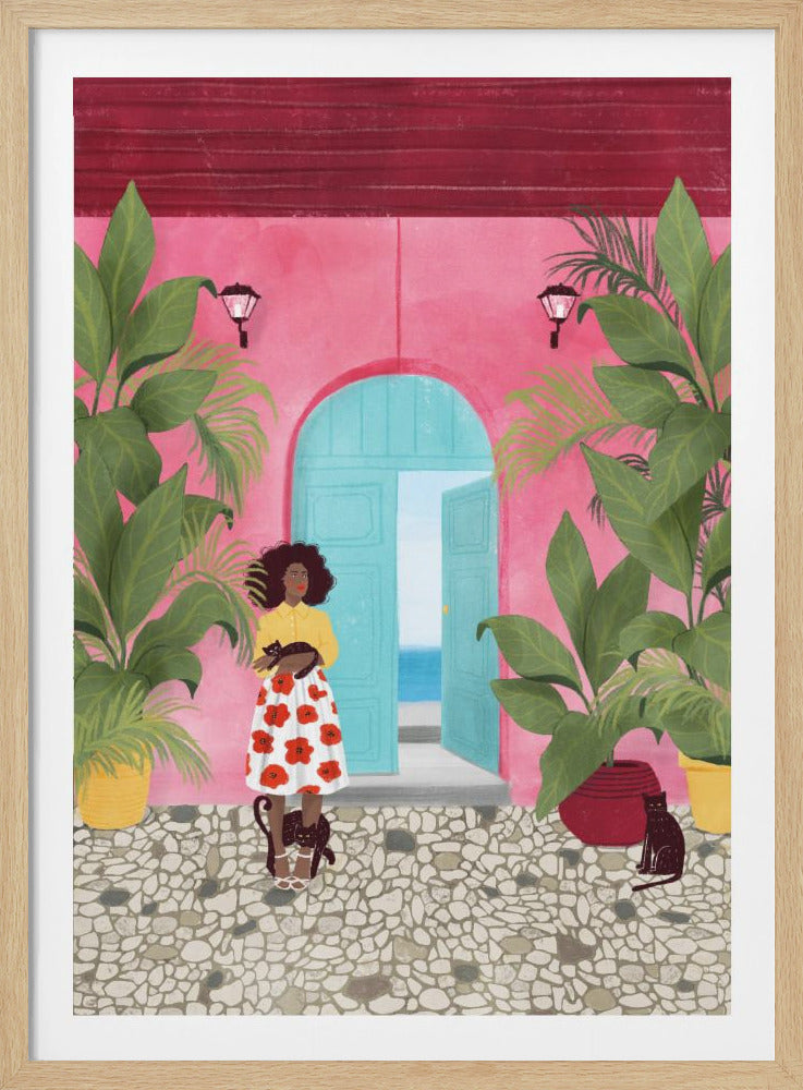 An illustration of a Black woman with an afro standing on a cobblestone patio in front of a bright pink building. She wears a yellow top and a white floral skirt and holds a black cat. Two other black cats are at her feet. An open turquoise door behind her reveals a view of the ocean, and the scene is framed by large potted tropical plants. Poster