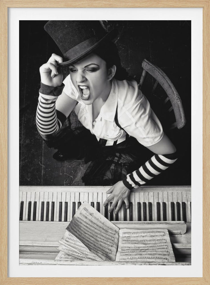 A dramatic black and white high-angle photograph of a woman in a top hat and striped arm warmers, shouting or singing passionately while seated at a piano with sheet music. Print