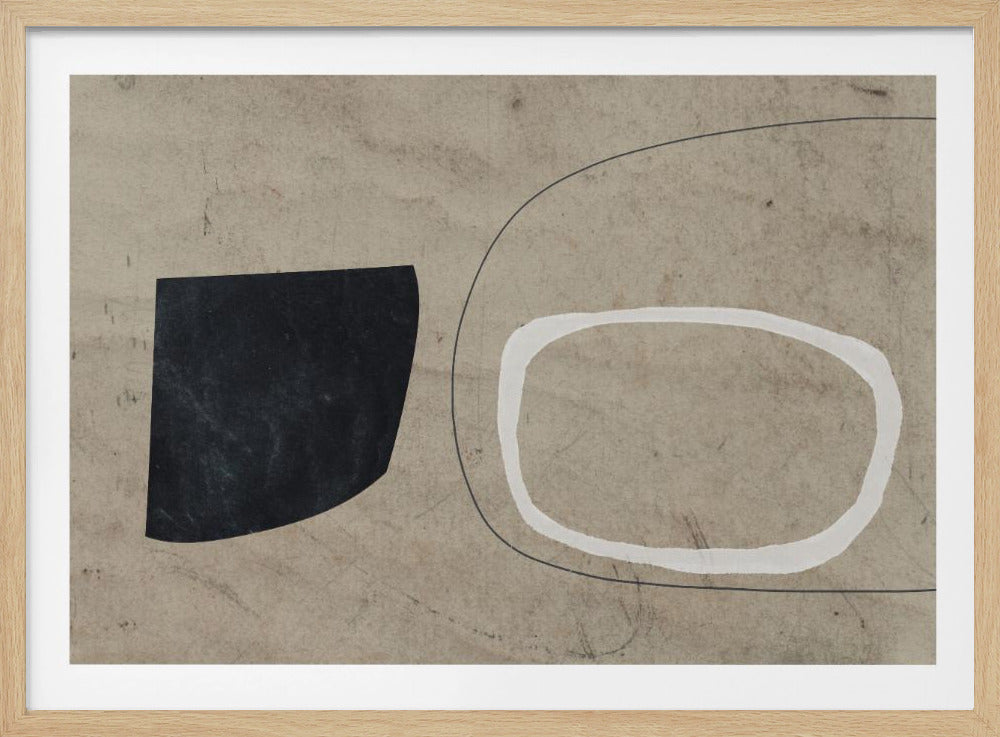 An abstract artwork in a silver frame featuring a textured beige background. On the left is a solid black, organic shape, and on the right is a hand-drawn, thick white outline of an oval, with a thin black curved line running behind it. Artwork