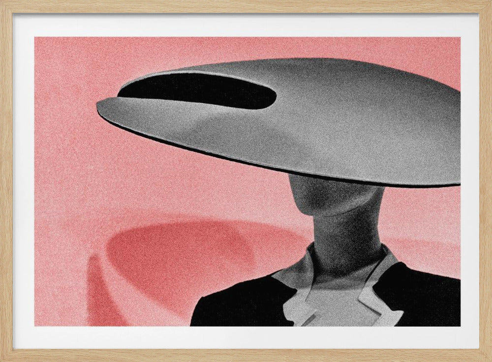 A framed, stylized black and white photograph of a person wearing a large, avant-garde grey hat against a textured pink background. The hat is wide and disc-shaped, obscuring the figure's face, creating a minimalist and mysterious aesthetic. Wall Art
