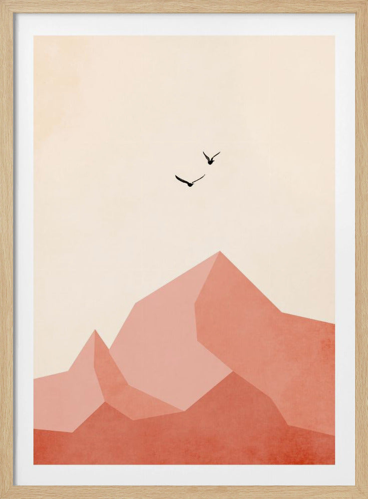 A minimalist framed artwork featuring geometric, faceted mountains in shades of pink and coral against a light cream sky. Two small black birds are shown flying above the peaks, creating a serene and modern nature scene. Wall Art