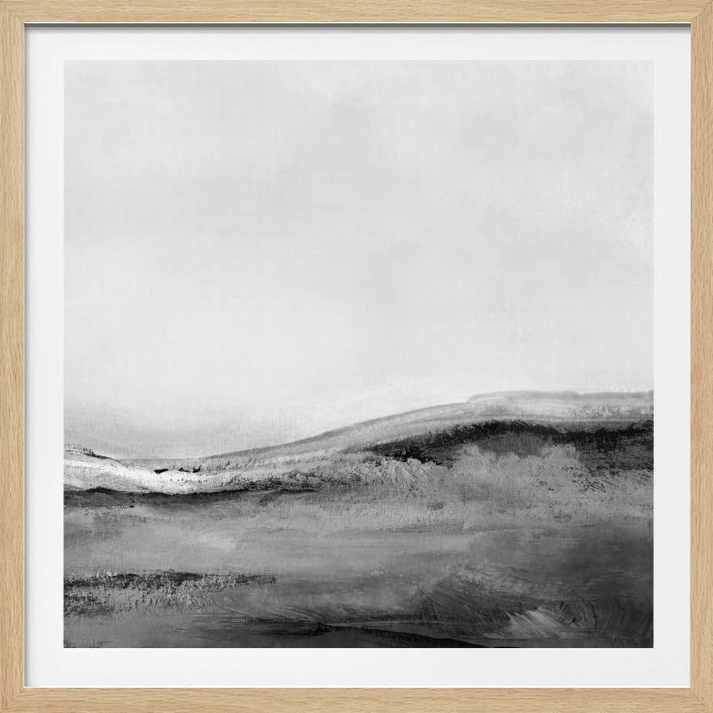 A minimalist abstract landscape painting in black, white, and shades of gray, housed in a square, light wood frame. The artwork features soft, rolling hills under a vast, pale sky, rendered with expressive brushstrokes. Print