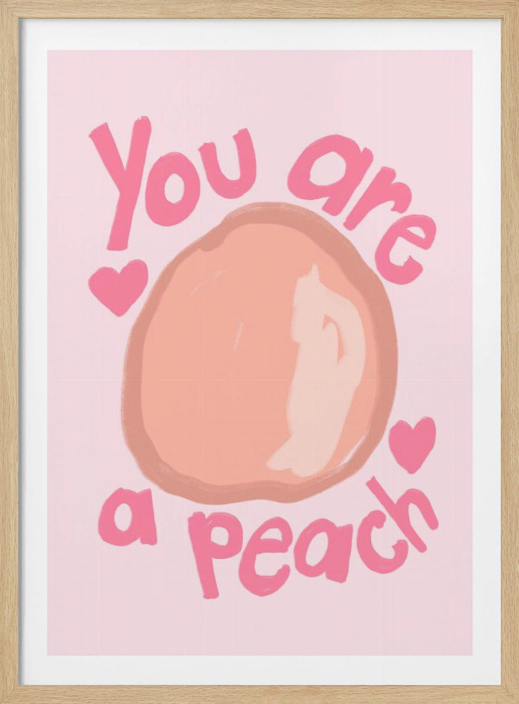 A cute art print with a light pink background featuring the phrase 'You are a peach' in a darker pink, hand-written style font. A large, simple illustration of a peach is in the center, flanked by two small pink hearts. The artwork is shown in a black frame. Poster