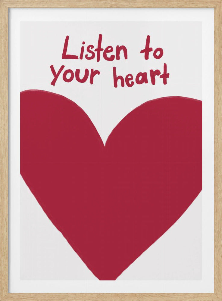 A framed art print with a large, imperfectly drawn red heart on a white background. Above the heart, the phrase 'Listen to your heart' is written in a casual, red handwritten font. Wall Art