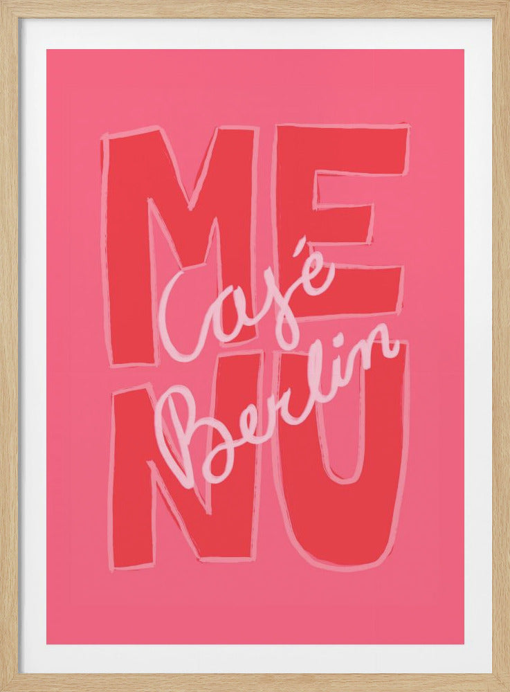 A graphic art print with a pink background featuring the word 'MENU' in large, blocky red letters. Overlaid in a light pink cursive script are the words 'Café Berlin'. The entire piece is framed in black. Print