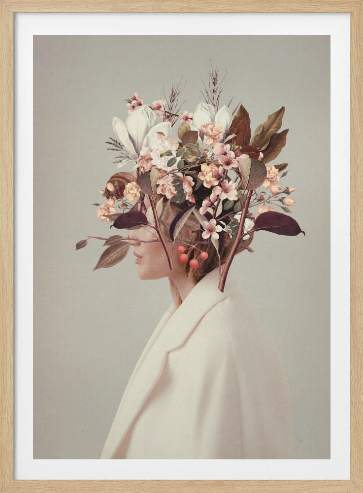 A surreal profile portrait of a woman wearing an off-white coat against a muted sage green background. Her head and hair are replaced by an elaborate bouquet of pink, white, and yellow flowers, leaves, and red berries, creating a dreamy, botanical-themed artwork. Artwork