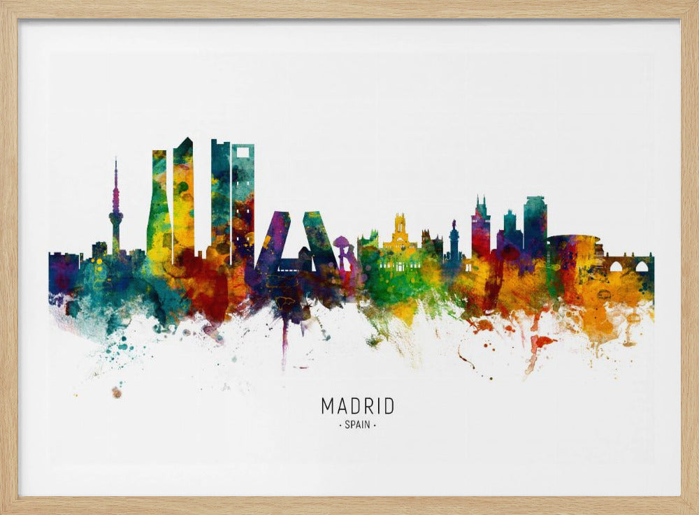 A colorful watercolor silhouette of the Madrid, Spain skyline against a white background, displayed in a silver frame. The artwork features vibrant splashes of blue, green, yellow, orange, and purple within the city's outline, with the text 'MADRID' and 'SPAIN' printed below. Decor