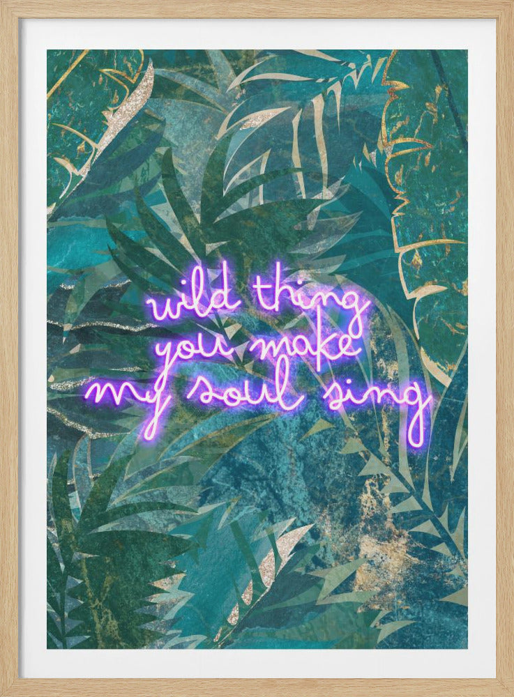 A modern art piece featuring the quote 'wild thing you make my soul sing' in glowing pink neon script, set against a dark, textured background of green and teal tropical leaves with gold accents, all enclosed in a simple black frame. Artwork