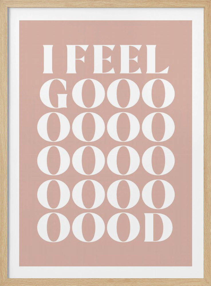 A framed typographic poster featuring the words 'I FEEL GOOOOOD' in a large, white serif font against a dusty pink background. The word 'GOOD' is stylized and stretched vertically with multiple rows of the letter 'O'. Artwork
