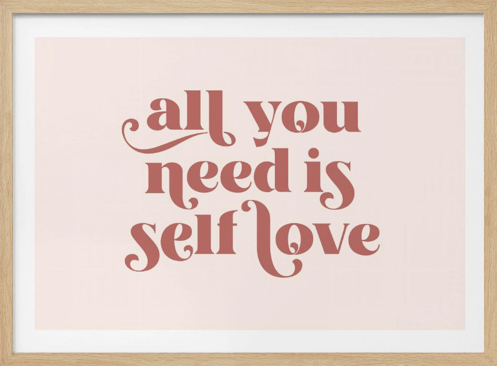 A framed art print with the phrase 'all you need is self love' in a stylish, dusty rose serif font on a light pink background. The artwork is enclosed in a simple silver frame. Poster