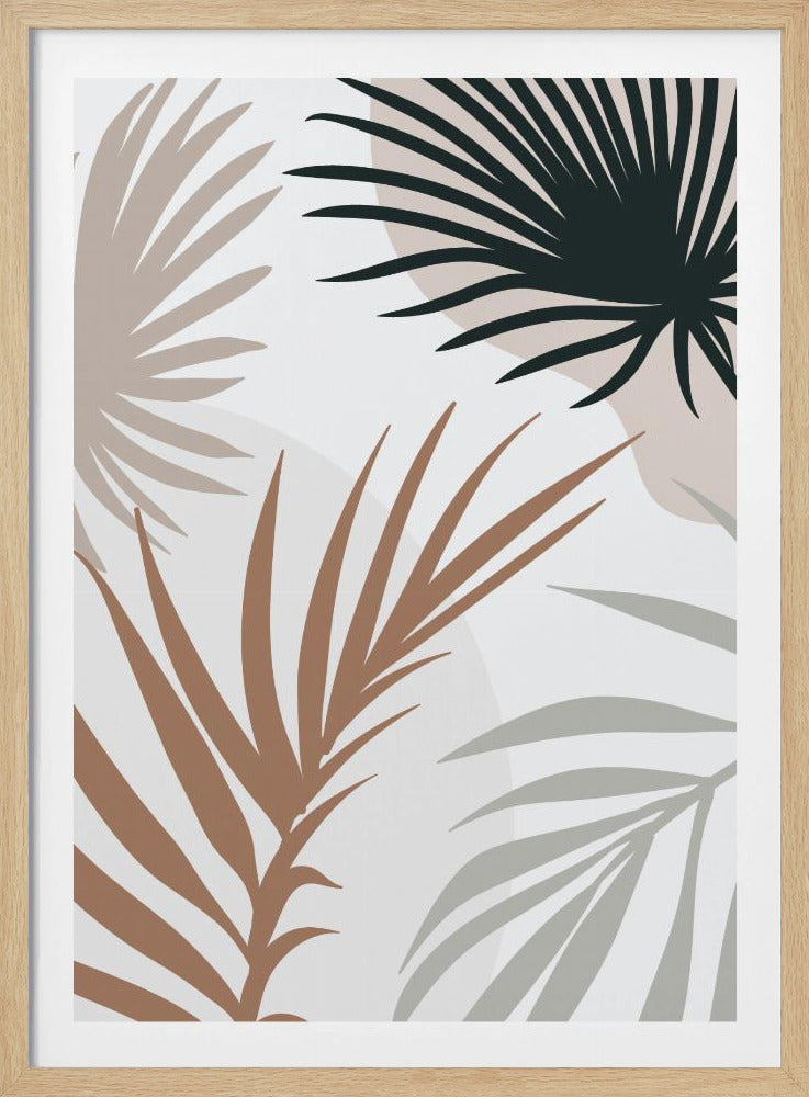 A modern art print in a black frame featuring stylized silhouettes of palm leaves. The fronds are colored in dark green, brown, beige, and light gray, overlapping on a light background with faint, large, muted pink circles. Print