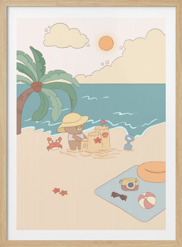 A charming cartoon illustration of a cute brown bear wearing a yellow sun hat, happily building a sandcastle on a sandy beach. A smiling red crab watches nearby, with a palm tree to the left and the blue ocean in the background under a sunny sky. In the foreground, a beach blanket holds a camera, sunglasses, and a beach ball. Print