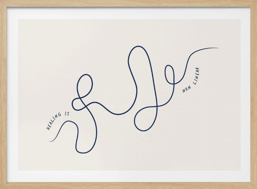 A minimalist framed artwork featuring a single continuous navy blue line that loops and meanders across a cream-colored background. The words 'HEALING IS NON LINEAR' are written in a simple font along the path of the line. Artwork