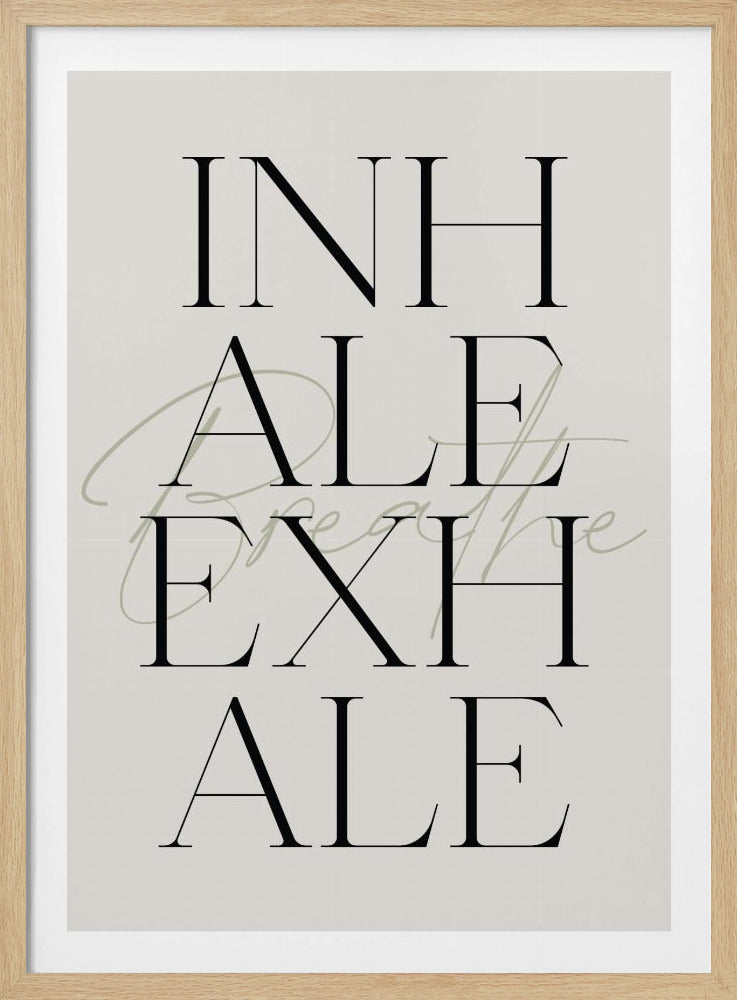 A minimalist typography poster in a thin black frame. The words 'INHALE' and 'EXHALE' are stacked vertically in a large, black serif font on a cream background. Overlaid is the word 'breathe' in a flowing, sage green script. Decor