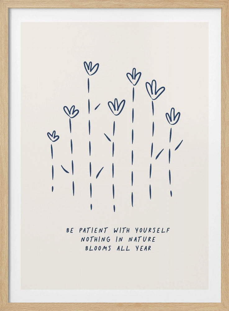 A minimalist art print in a black frame, featuring a simple dark blue line drawing of seven flowers on a cream background. Below the flowers is the handwritten quote, 'BE PATIENT WITH YOURSELF NOTHING IN NATURE BLOOMS ALL YEAR'. Print