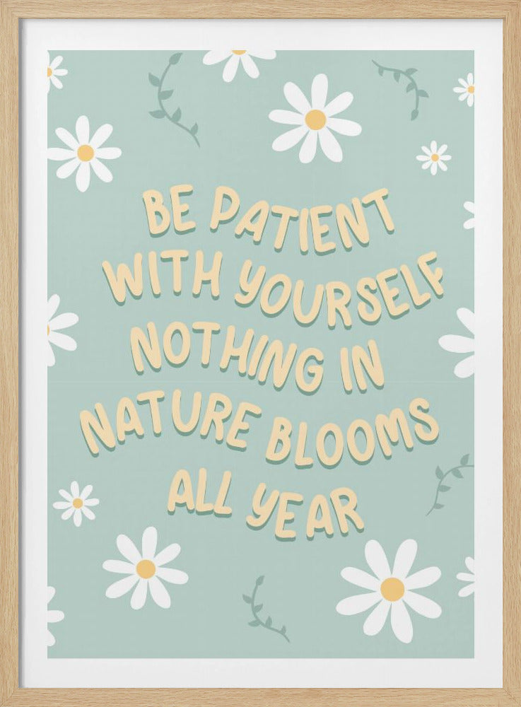 An inspirational poster with the quote 'Be patient with yourself nothing in nature blooms all year' in a creamy yellow, rounded font. The background is a soft mint green decorated with a pattern of white daisies and small green vines. Artwork